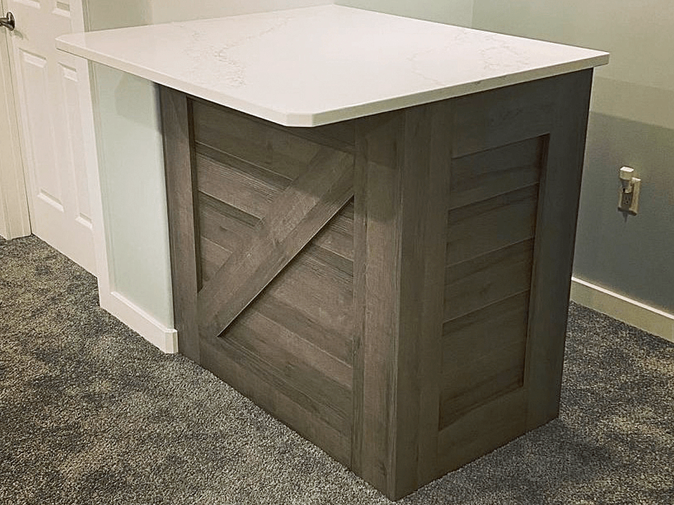 A Kitchen Island Cabinet with Stone Countertop