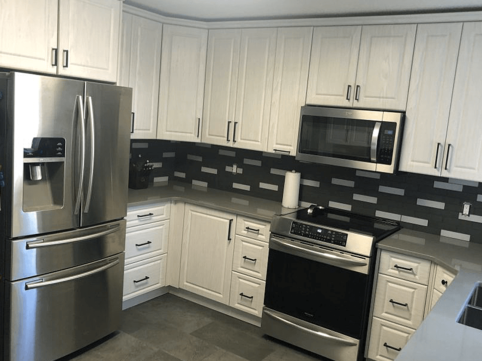A Kitchen with Wood Cabinets and Stone Countertop