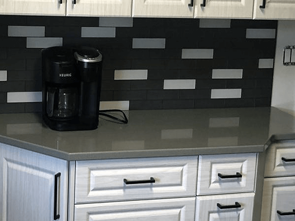A Kitchen with Cabinets and Stone Countertop